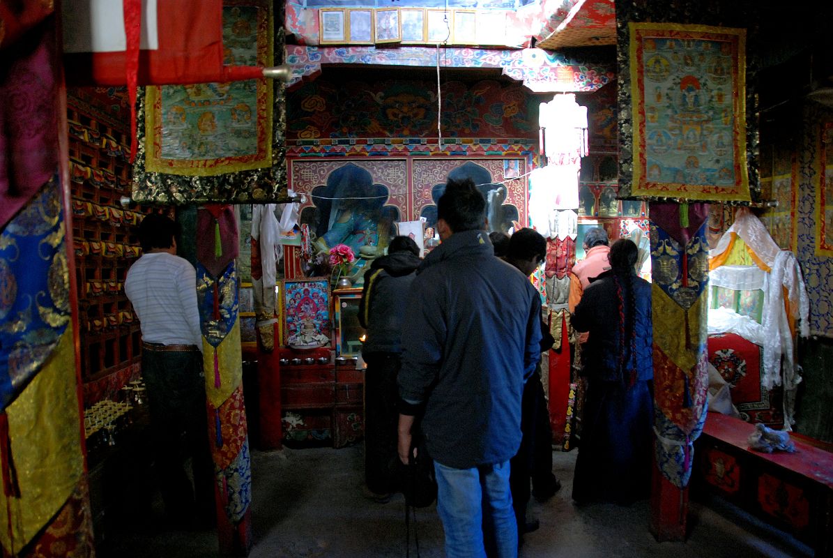 36 Inside Old Chiu Gompa My guide and driver mingle among the pilgrims in the old Chiu Gompa.